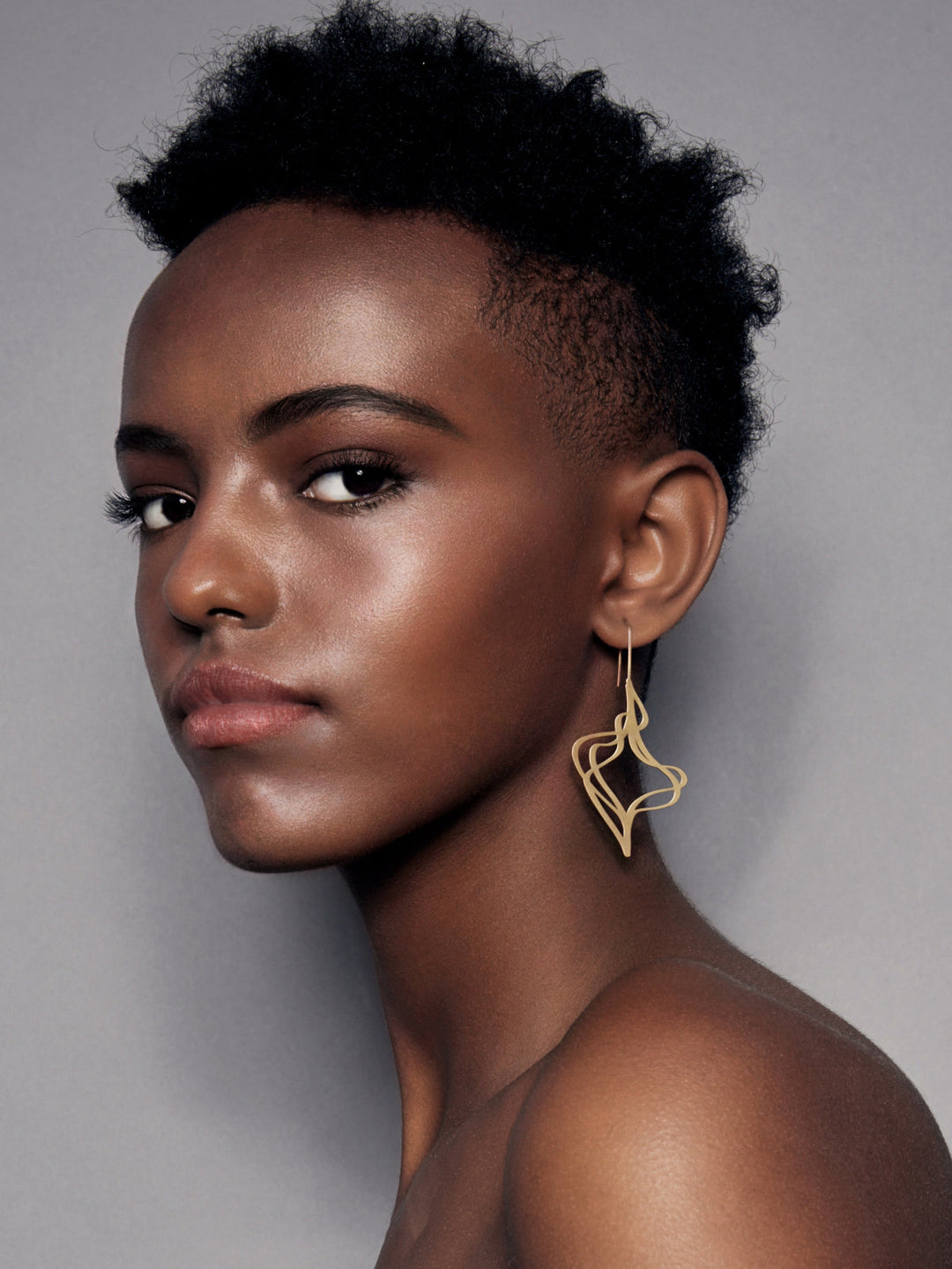 inSync design wearable art in matt gold
